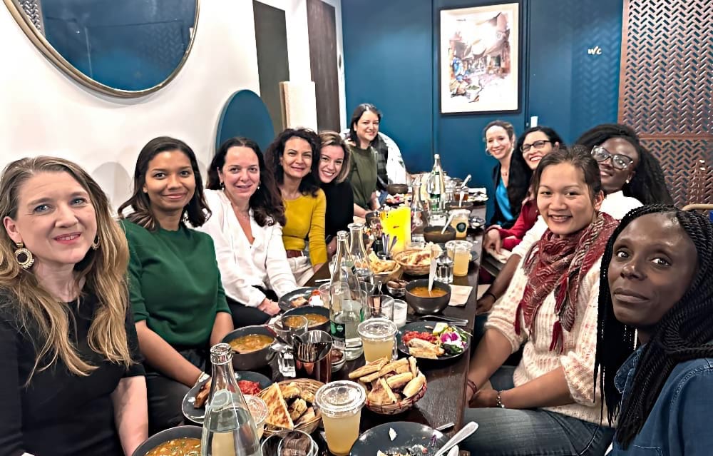 A monthly dinner with a diverse group of 12 women.