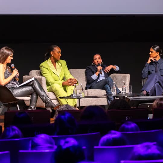 3 diverse women speaking on a couch